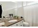Clean bathroom with a granite countertop, a large mirror, and a shower with a curtain at 6570 Freemont Ln, Carmel, IN 46033