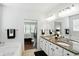 Bathroom with double vanity, granite counters, and soaker tub at 6570 Freemont Ln, Carmel, IN 46033