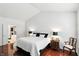 Bright bedroom featuring vaulted ceilings, a large bed, and ensuite bathroom at 6570 Freemont Ln, Carmel, IN 46033