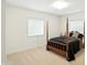 Bedroom with neutral carpet, a four-poster bed, and windows with blinds at 6570 Freemont Ln, Carmel, IN 46033