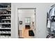 View from a closet featuring an open bathroom with a tub and double vanity at 6570 Freemont Ln, Carmel, IN 46033