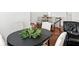 Stylish dining table with a lush centerpiece and access to the second floor at 6570 Freemont Ln, Carmel, IN 46033