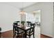 Chic dining room with a stylish chandelier and views into the living room at 6570 Freemont Ln, Carmel, IN 46033