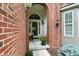 Charming front porch featuring an arched doorway, a potted plant, and a cozy seating area at 6570 Freemont Ln, Carmel, IN 46033