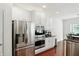Bright kitchen featuring stainless steel appliances, including a refrigerator, oven, and microwave at 6570 Freemont Ln, Carmel, IN 46033