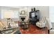 The open living room has a fireplace, striped chairs, and modern décor at 6570 Freemont Ln, Carmel, IN 46033