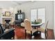 Bright living room boasts a fireplace, modern furniture, and gleaming wood floors at 6570 Freemont Ln, Carmel, IN 46033
