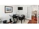 Bright office space with a black desk, an ergonomic chair, and a view of the upstairs hallway at 6570 Freemont Ln, Carmel, IN 46033