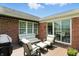 Outdoor patio features cozy seating and awning, perfect for relaxing and entertaining at 6570 Freemont Ln, Carmel, IN 46033