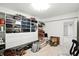 Organized storage room featuring built-in cabinets, shelving, and decorative items at 6570 Freemont Ln, Carmel, IN 46033