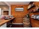 Stylish bar area with wooden walls and countertop, perfect for entertaining guests at 6664 Kara Ln, Brownsburg, IN 46112