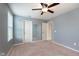 Bright bedroom featuring a ceiling fan and ample closet space, perfect for comfortable living at 6664 Kara Ln, Brownsburg, IN 46112