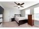Cozy bedroom with a ceiling fan, a window, and a comfortable bed, creating a relaxing retreat at 6664 Kara Ln, Brownsburg, IN 46112