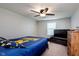 This bedroom is furnished with a full bed and a dresser and is illuminated by natural light from a window at 6664 Kara Ln, Brownsburg, IN 46112