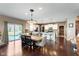 Open kitchen and dining area with modern appliances, granite countertops, and ample seating at 6664 Kara Ln, Brownsburg, IN 46112