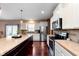 Contemporary kitchen featuring granite countertops, stainless steel appliances, and ample cabinet space at 6664 Kara Ln, Brownsburg, IN 46112