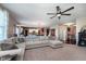 Spacious living room with comfortable seating, large windows, and open floor plan at 6664 Kara Ln, Brownsburg, IN 46112
