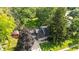 Aerial view of the property surrounded by lush trees, showcasing the home's setting at 6739 Westdrum Rd, Indianapolis, IN 46241