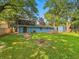 Expansive backyard features a fire pit, a storage shed and a wood deck, perfect for outdoor entertaining and relaxation at 6739 Westdrum Rd, Indianapolis, IN 46241