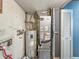 Basement area with mechanical systems like water heater and furnace at 6739 Westdrum Rd, Indianapolis, IN 46241