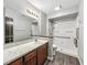 Accessible bathroom with walk-in shower, grab bars and large vanity at 6739 Westdrum Rd, Indianapolis, IN 46241
