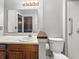 View of a bathroom with a large mirror, sink, and walk-in shower at 6739 Westdrum Rd, Indianapolis, IN 46241
