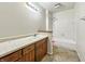 Bathroom featuring a single sink vanity and shower-tub combination at 6739 Westdrum Rd, Indianapolis, IN 46241