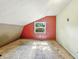 Bedroom featuring a dormer window and sloped ceiling with a dated carpeted floor at 6739 Westdrum Rd, Indianapolis, IN 46241