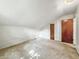 Bedroom with white walls and two wooden doors, showcasing renovation and customization potential at 6739 Westdrum Rd, Indianapolis, IN 46241