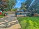 Charming blue ranch-style home featuring a stone facade and well-manicured lawn at 6739 Westdrum Rd, Indianapolis, IN 46241