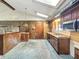 Cozy kitchen with wood cabinets, stainless steel microwave, and bright skylight at 6739 Westdrum Rd, Indianapolis, IN 46241