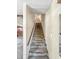 Carpeted stairway with wooden handrail leading to the upper level at 6739 Westdrum Rd, Indianapolis, IN 46241