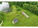 Lush property features a private pond, greenhouse, and outbuilding, creating a tranquil retreat at 750 N 500 W, Lebanon, IN 46052
