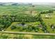 A serene aerial view shows the property with pond and surrounding farmland at 750 N 500 W, Lebanon, IN 46052