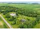 A beautiful pond, a pool and the main home are seen from above at 750 N 500 W, Lebanon, IN 46052