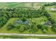A captivating aerial view of the property, showcasing a pond and sprawling green landscape at 750 N 500 W, Lebanon, IN 46052