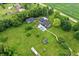 Expansive property with a pool, outbuildings, and lush greenery offers a private and serene setting at 750 N 500 W, Lebanon, IN 46052