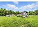 A quaint backyard with an outbuilding and a greenhouse at 750 N 500 W, Lebanon, IN 46052