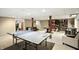 Large basement with ping pong table, carpeted floors, furniture, and ample space for activities at 750 N 500 W, Lebanon, IN 46052