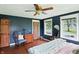 Bedroom with hardwood floors, natural light, and a rustic wood door at 750 N 500 W, Lebanon, IN 46052