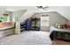 Bright bedroom with sloped ceilings, a ceiling fan, a bed, and ample display shelving at 750 N 500 W, Lebanon, IN 46052