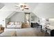 Spacious bedroom/study with a ceiling fan, sloped ceilings, and a functional layout with room for relaxation and productivity at 750 N 500 W, Lebanon, IN 46052