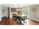 The dining room features a rustic table and access to the backyard at 750 N 500 W, Lebanon, IN 46052
