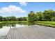 Relaxing dock on a serene pond surrounded by lush greenery at 750 N 500 W, Lebanon, IN 46052