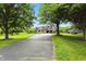 Picturesque home nestled amongst mature trees features an attached garage and long, paved driveway at 750 N 500 W, Lebanon, IN 46052
