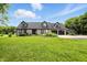 Charming home boasts dormer windows, a two-car garage, and lush landscaping at 750 N 500 W, Lebanon, IN 46052