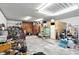 The cluttered shed interior with a variety of items and shelves at 750 N 500 W, Lebanon, IN 46052