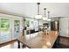 Bright kitchen featuring a large island, stainless steel appliances, and a door leading to the outside at 750 N 500 W, Lebanon, IN 46052
