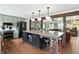 Open kitchen featuring an island with seating and views into the living spaces at 750 N 500 W, Lebanon, IN 46052