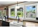 Bright kitchen sink with granite countertops and a view of the pool and backyard at 750 N 500 W, Lebanon, IN 46052
